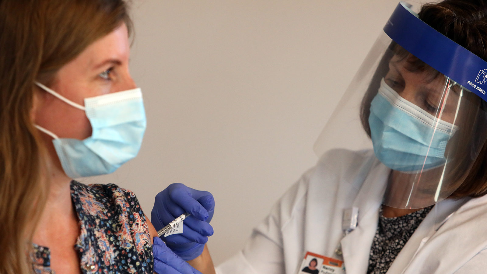 health care worker receives the vaccine