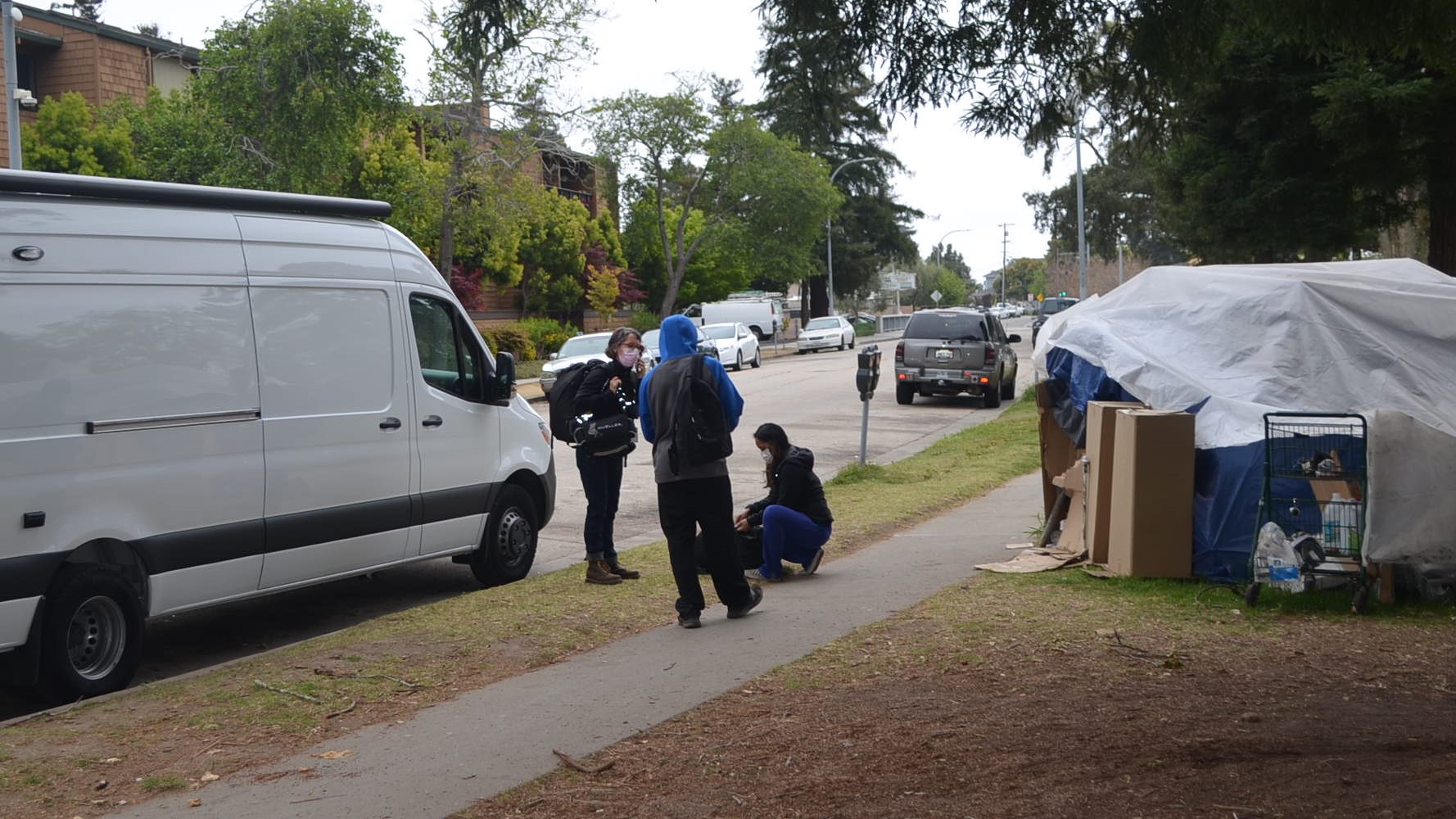 Public Health Nurses Suzanne Samson, at left, and Marie DelRosario respond to a man near Dakota Avenue as part of the Homeless Persons' Health Project.