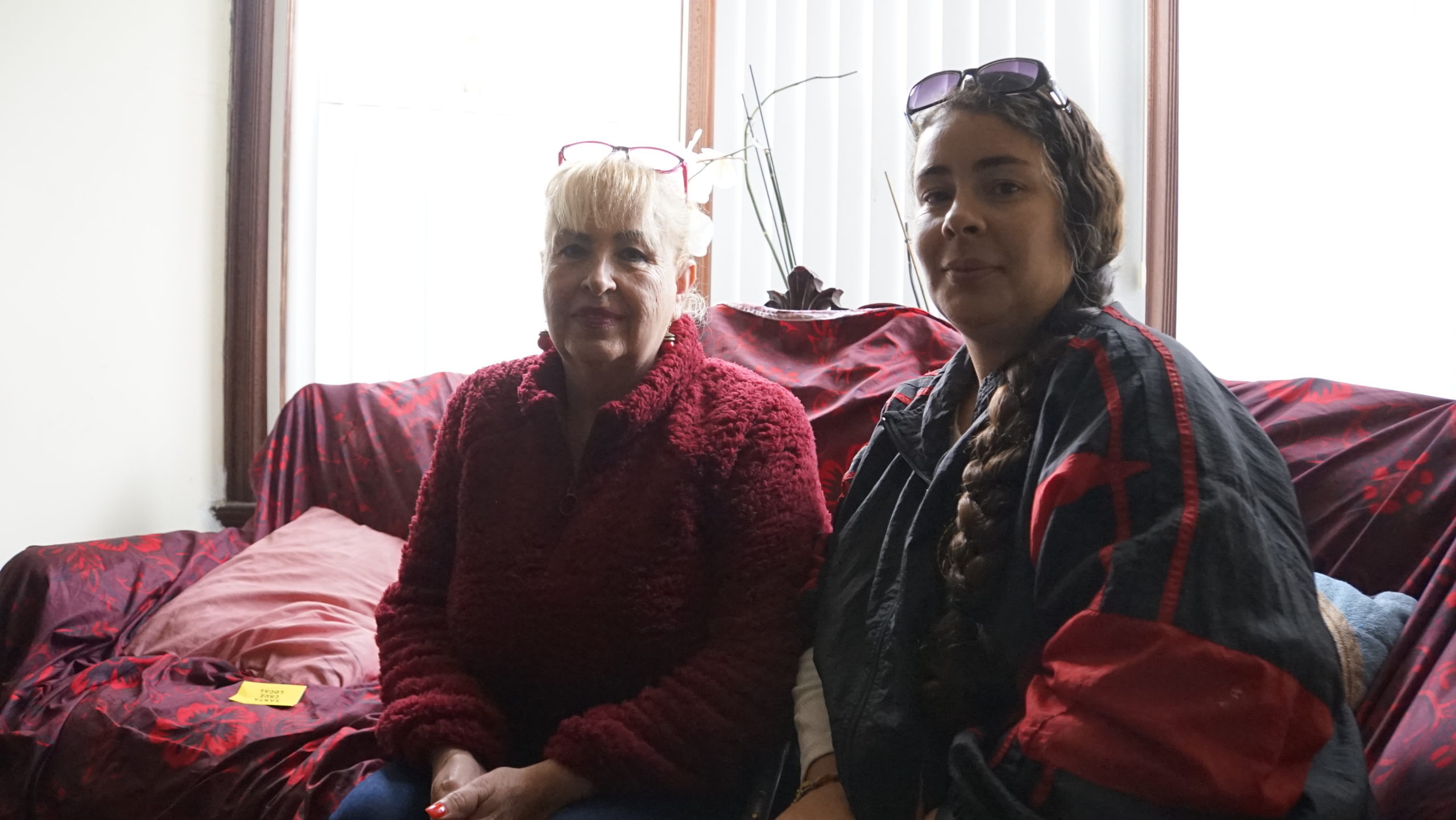 Olivia Sanchez and her daughter Mayra Sanchez sit on their couch at their Maple Street home in Watsonville.