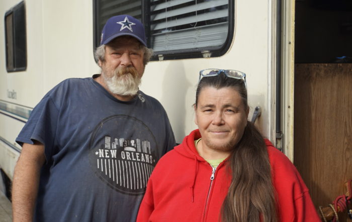 Brian Ashe and Sherri Fry stand next to their RV on Natural Bridges Drive in Santa Cruz