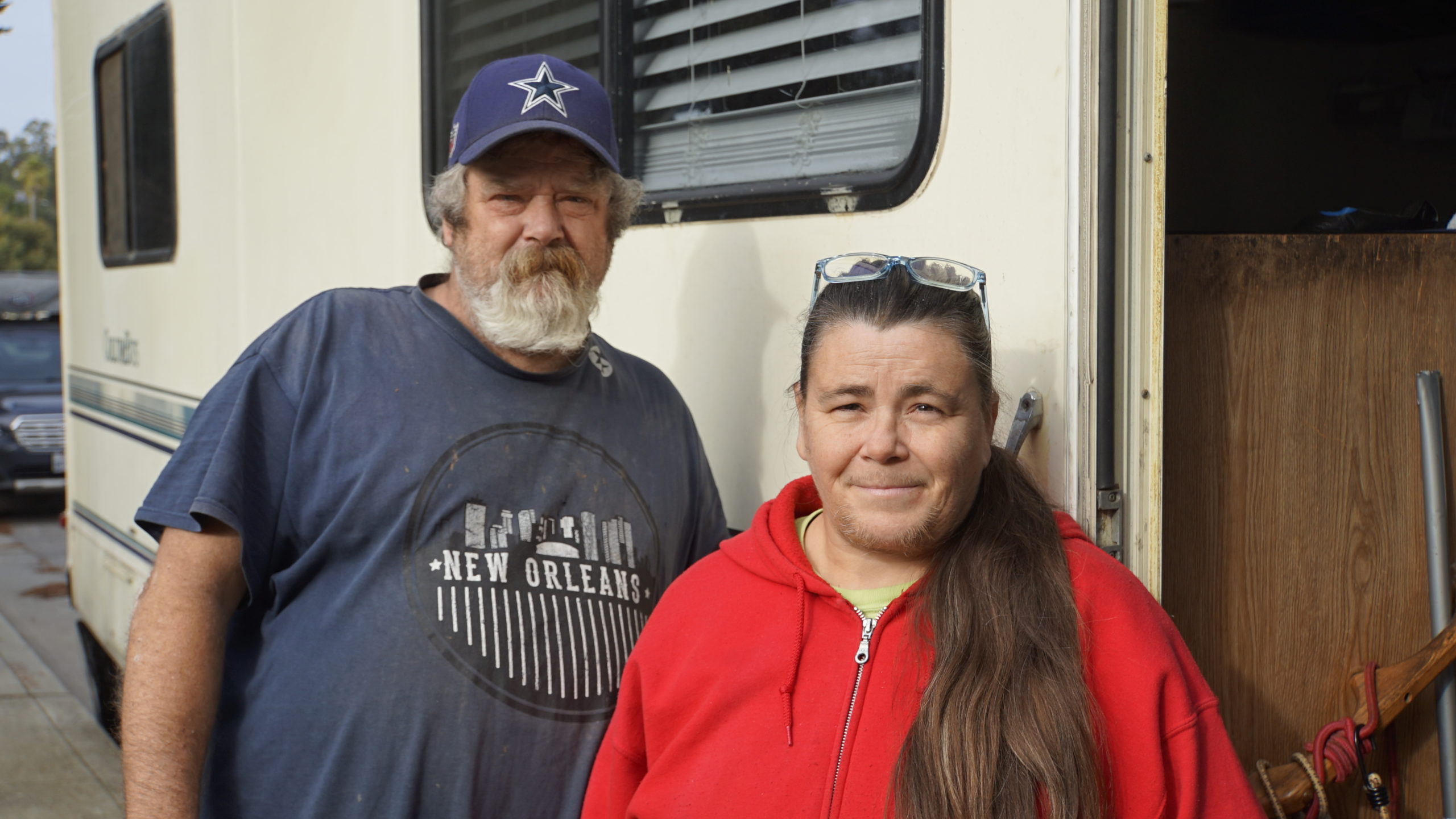 Brian Ashe and Sherri Fry stand next to their RV on Natural Bridges Drive in Santa Cruz