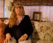 Silvana Hays sits on her couch in her RV in Santa Cruz