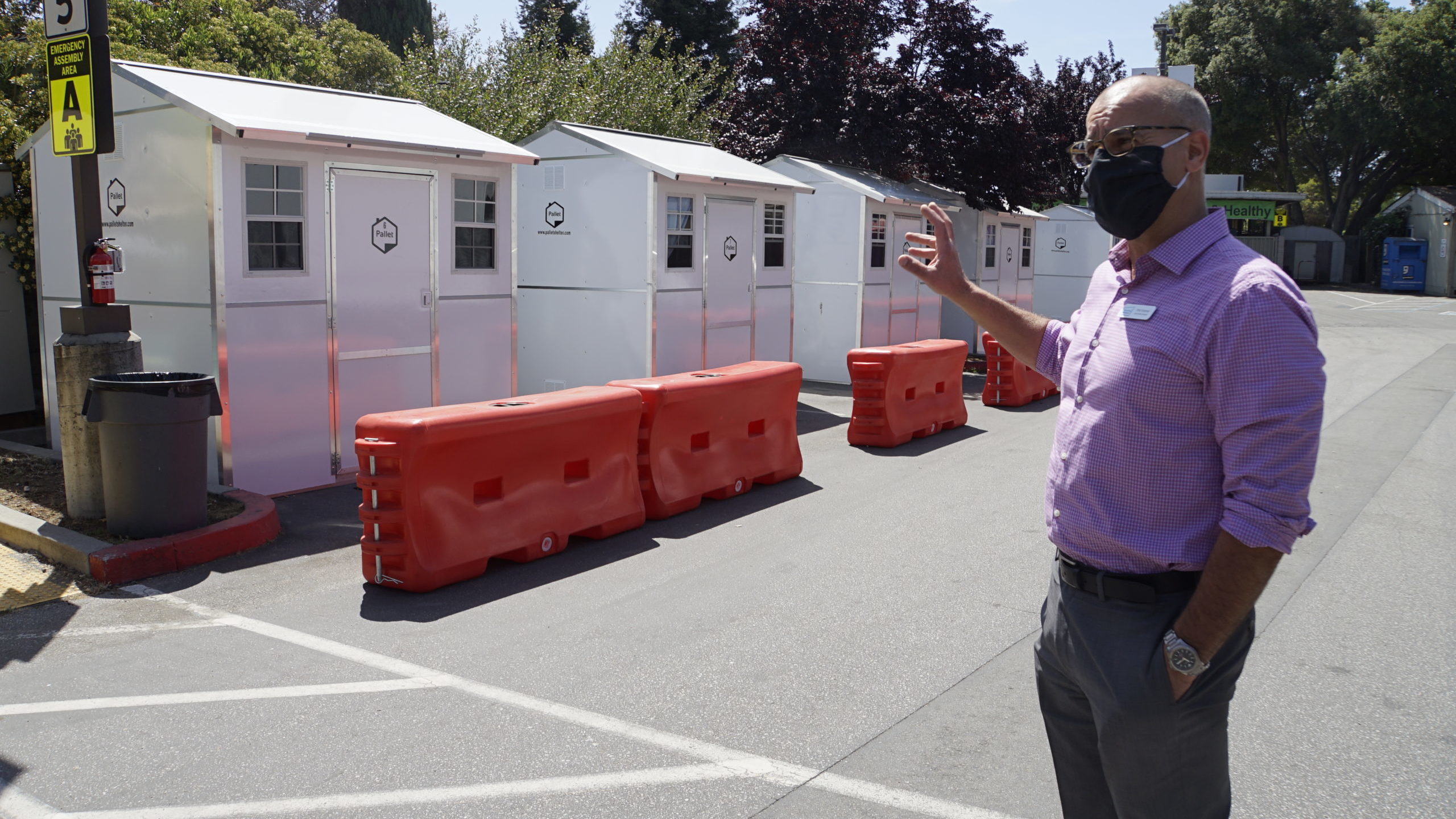Housing Matters CEO Phil Kramer gives a tour of Pallet Shelters in May 2020.