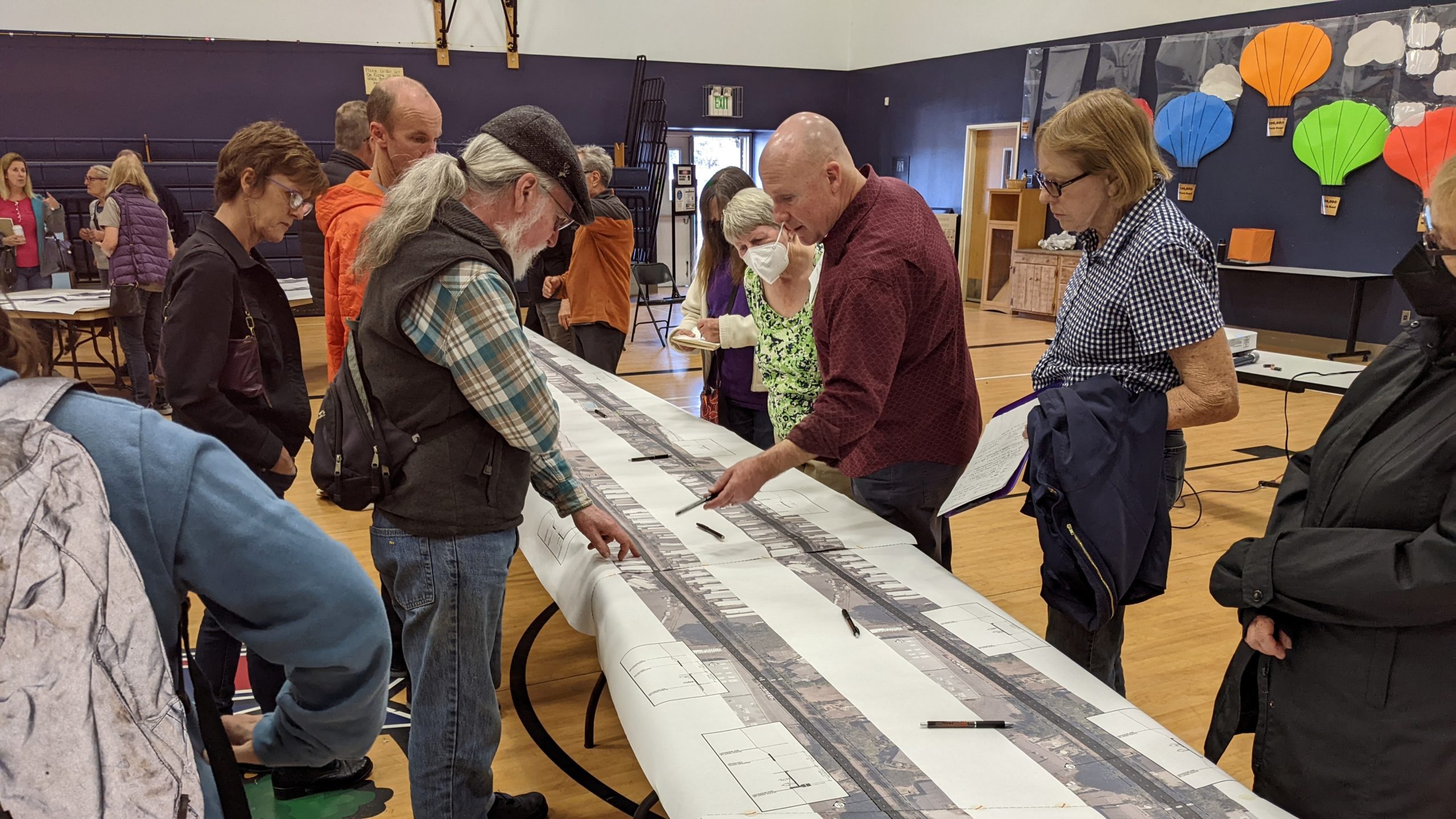 Residents discuss options for the rail trail from Live Oak to Seacliff at a meeting April 13 at Live Oak Elementary School. Mike Sherrod, a principal at RRM Design Group, points to part of a proposed design.