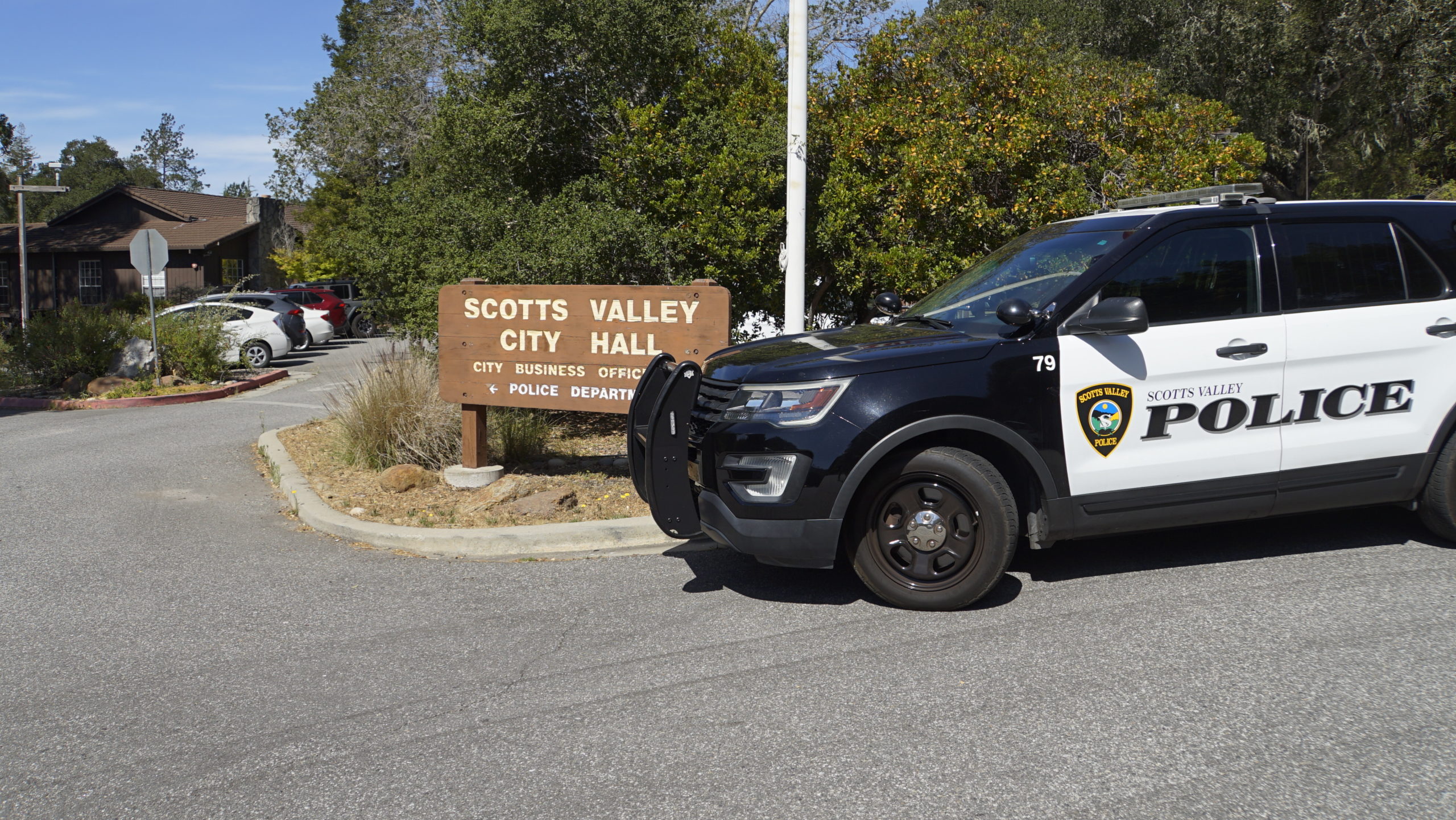 A Scotts Valley police car sits near the sign for City Hall.