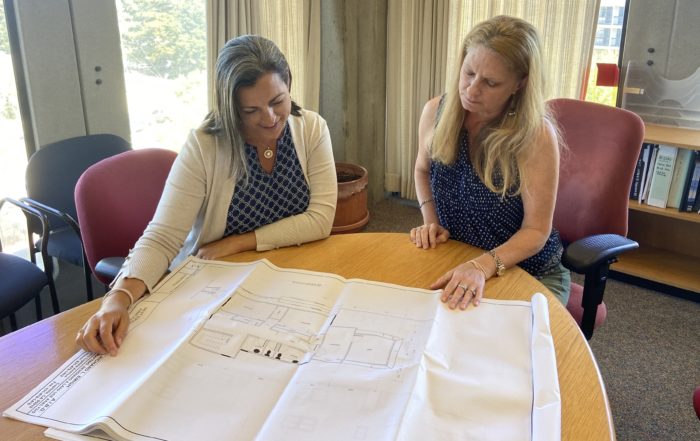 Carolyn Burke, left, is the assistant director of community development and infrastructure for the County of Santa Cruz. She looks at building plans with Santa Cruz County Principal Planner Stephanie Hansen. (Grace Stetson — Santa Cruz Local)
