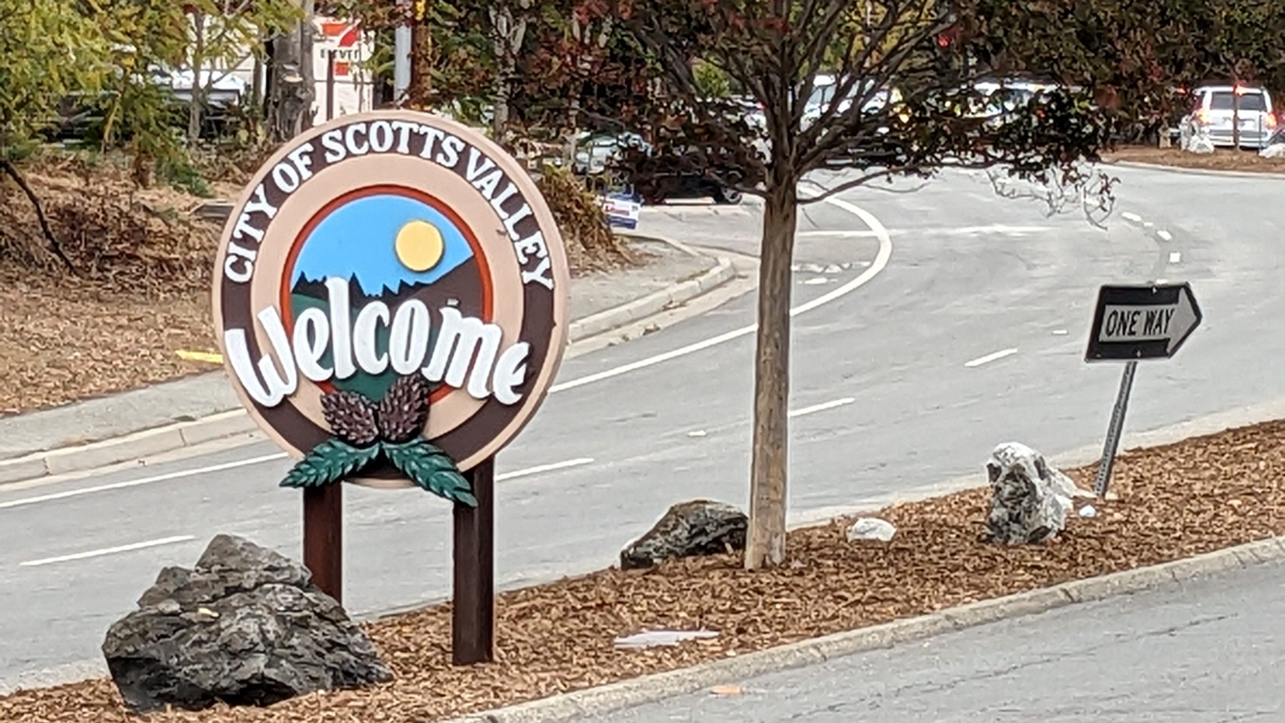 A sign on a road reads "City of Scotts Valley Welcome"