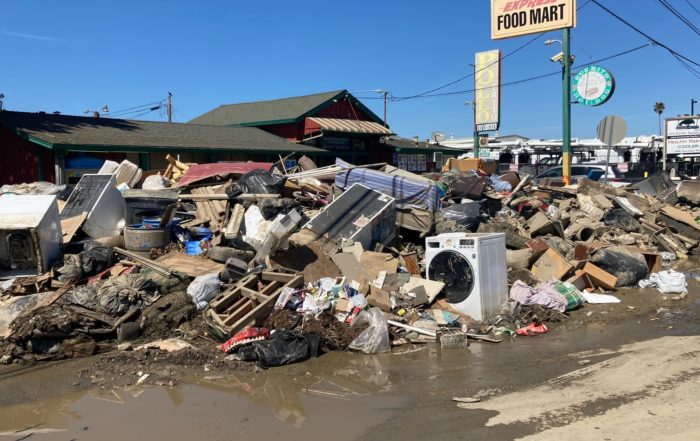 A pile of damaged belongings on Salinas Road in Pajaro in March 2023 following a flood from the Pajaro River.