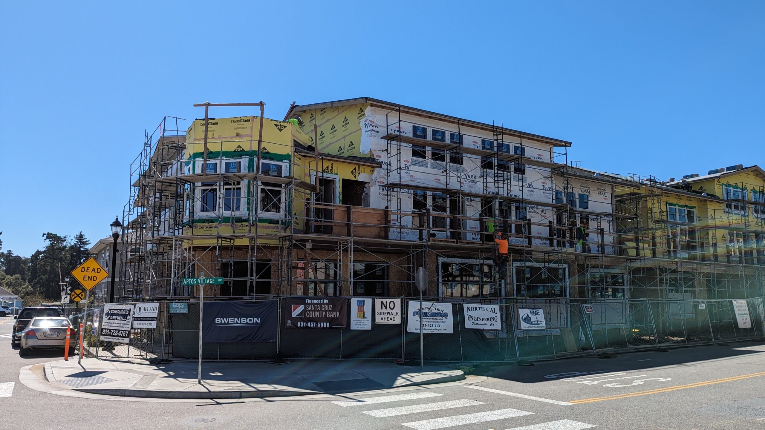 Work on homes and retail space continues on Aptos Village Way in March 2024. (Stephen Baxter — Santa Cruz Local)