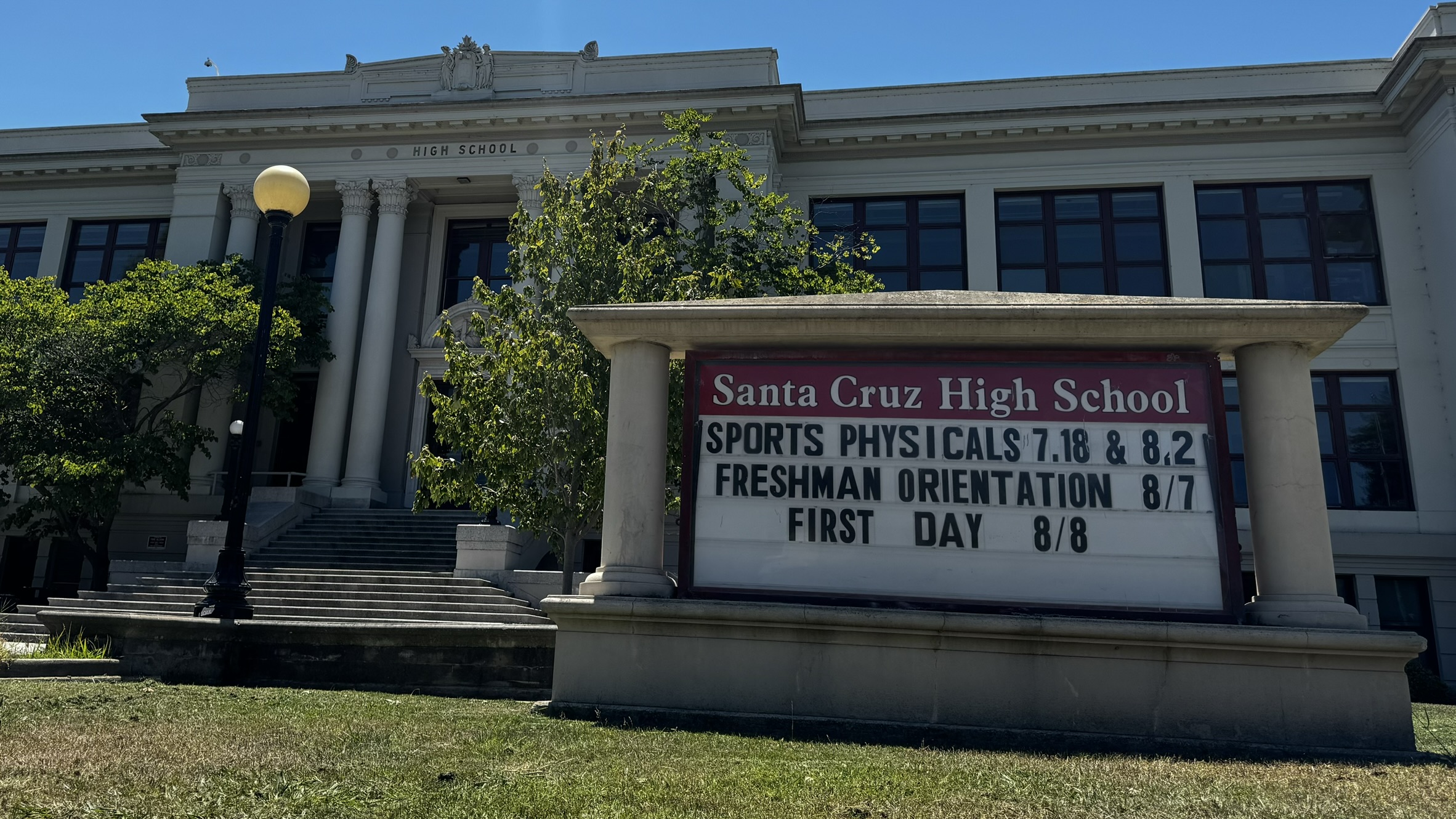 The front of Santa Cruz High has a sign that shows upcoming events including freshman orientation.
