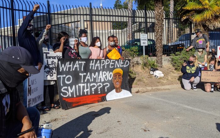 Family of Tamario Smith and supporters stand outside Santa Cruz Main Jail.