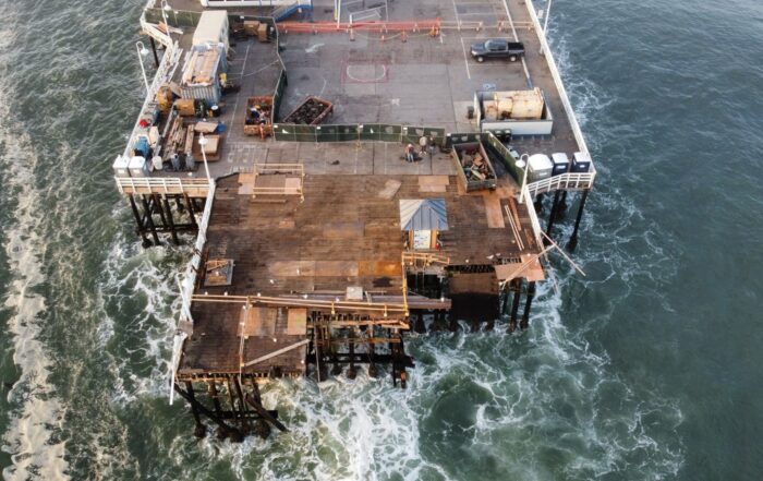 An aerial photo of the end of the Santa Cruz wharf shows the ragged edge after a large swell tore off about 150 feet of the wooden pier on Dec. 23, 2024.