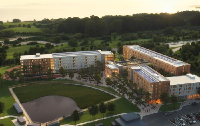 A rendering shows a proposal for a three-wing building of 624 beds of student housing on Cabrillo College's Aptos campus.