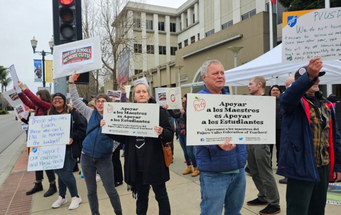 Teachers and supporters rally against layoffs before a Feb. 12 Pajaro Valley Unified School Board meeting.