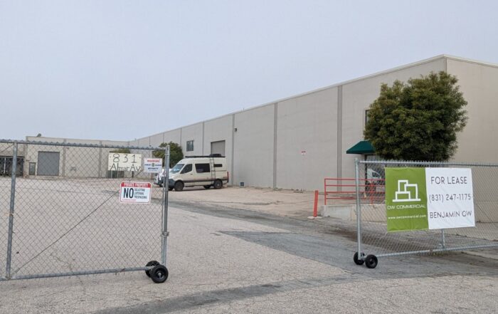 A gate goes around the parking lot entrance to 831 Almar Ave. in Santa Cruz.