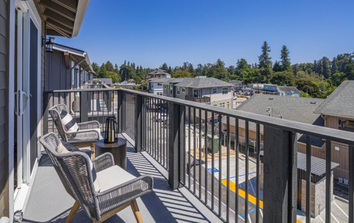A photo of a balcony that's part of Aptos Village Phase II housing development in 2025.