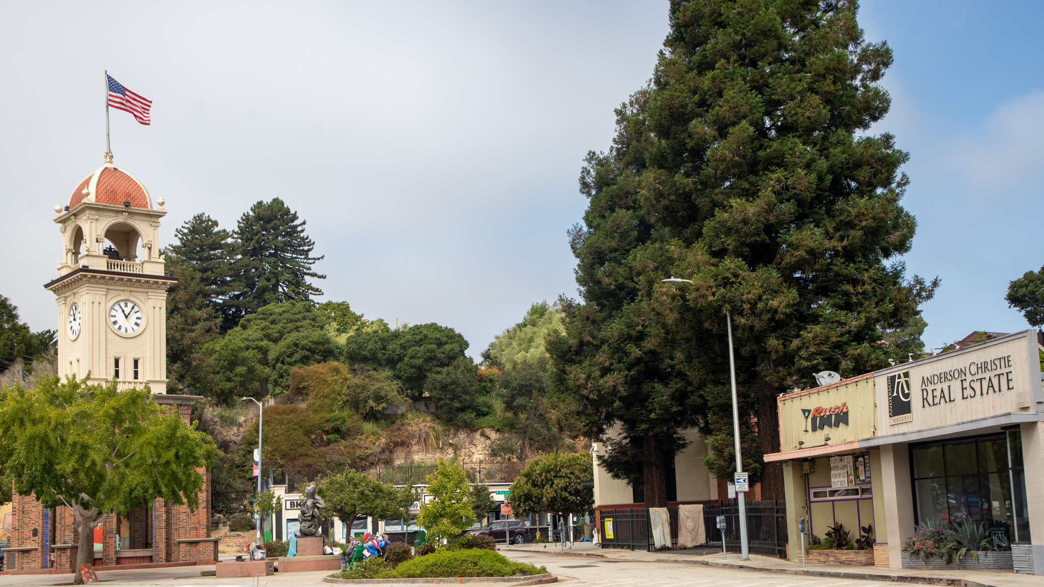 The Town Clock is seen next to the buildings on North Pacific Avenue that are slated for redevelopment into an eight-story apartment building.